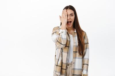 Surprised Woman Hiding Half Her Face in Awe of Exciting Promotional Deal – Free Stock Photo, Download for Free