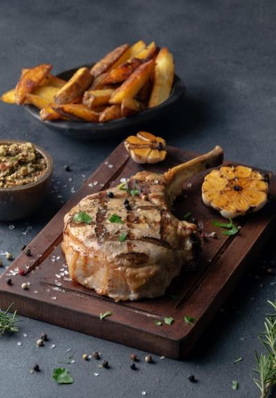 Seasoned Steak on a Board Served with Fries – Free Download