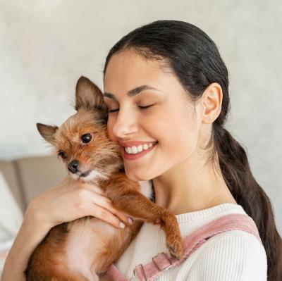 Smiling Girl Embracing Her Pet – Free Download