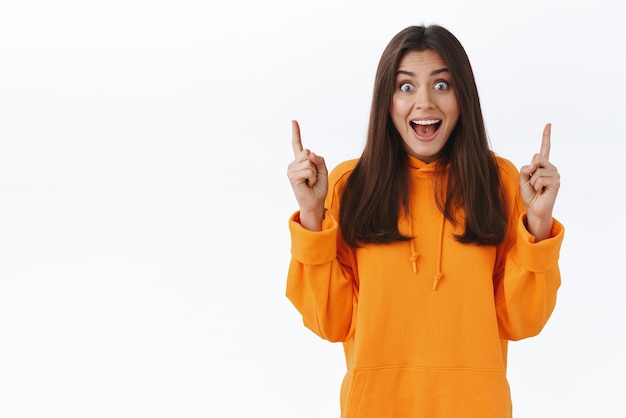 Gorgeous Girl in Orange Hoodie Expressing Excitement and Surprise – Free Download