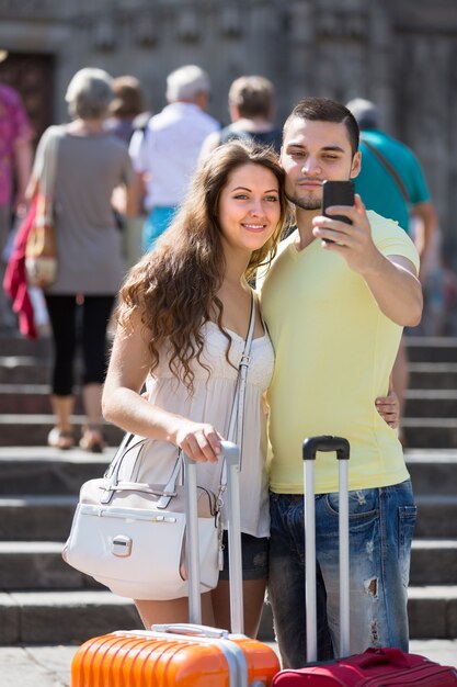 Couple Taking a Selfie on the Street – Free Download