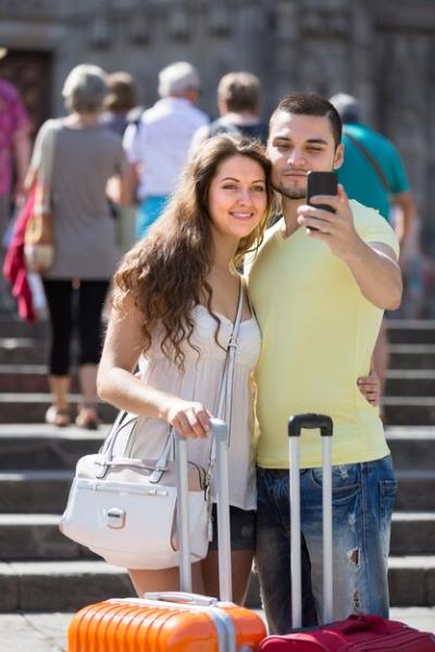 Couple Taking a Selfie on the Street – Free Download