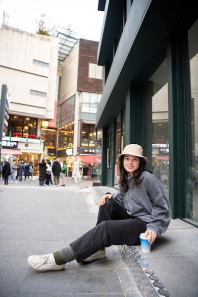 Young Woman in a Bucket Hat in the City – Free Stock Photo for Download