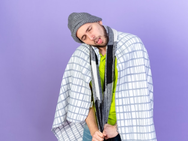 Young Caucasian Ill Man in Winter Hat and Scarf Against Purple Wall – Free Download