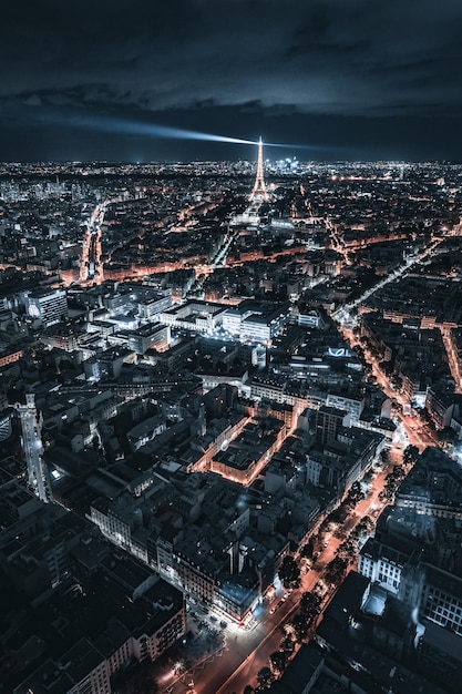 Aerial View of the Eiffel Tower and City Lights at Night – Free to Download