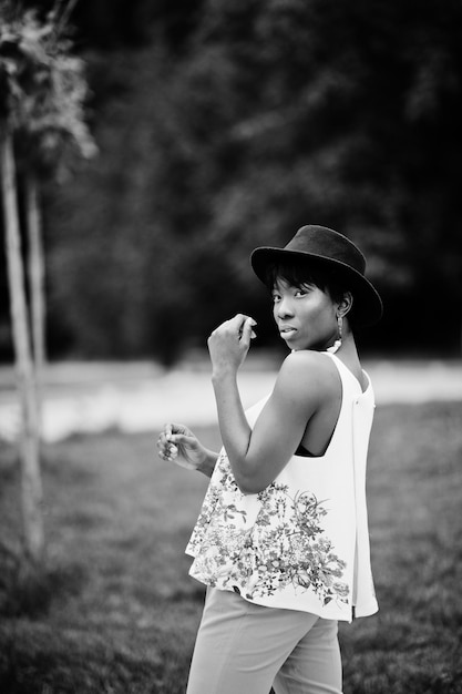 African American Model in Green Pants and Black Hat at Park – Free Download