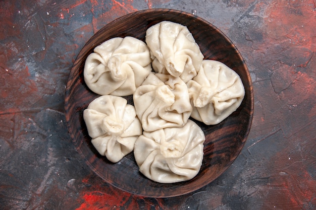 Close-Up View of Khinkali Bowl on a Red-Grey Table – Free Stock Photo, Download Free