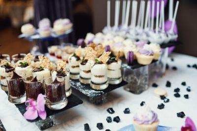 Tasty Sweets Covered with Violet and White Glaze on Black – Free Stock Photo for Download