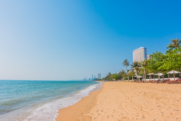 Beautiful Beach and Sea with Palm Tree – Download Free Stock Photo