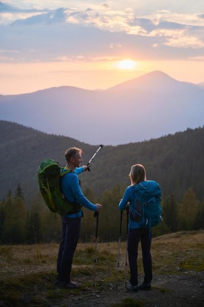 Two Travelers Hiking in Summer Mountains – Free Stock Photo Download