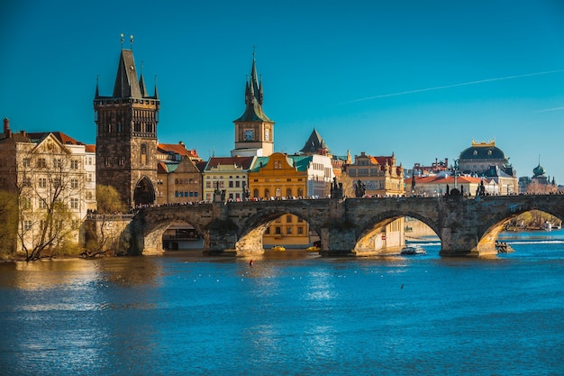 Beautiful Bridge Over River in City Against Clear Blue Sky – Free Download