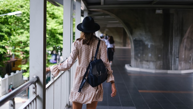 Caucasian Woman in Medical Face Mask Walking on Subway in Bangkok During Pandemic – Free Download