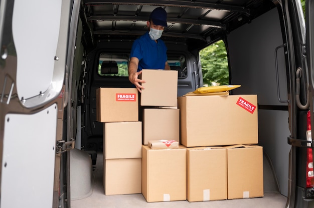 Delivery Man Carrying Box – Free Stock Photo for Download