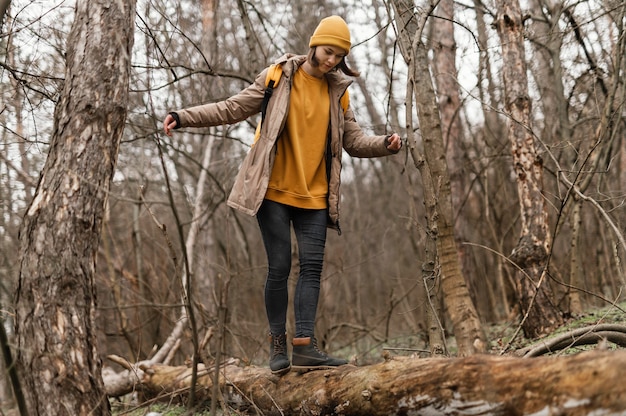 Woman Walking on Tree Branch – Free Stock Photo for Download