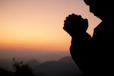 Girl Praying Silhouette Against a Beautiful Sky â Free Download