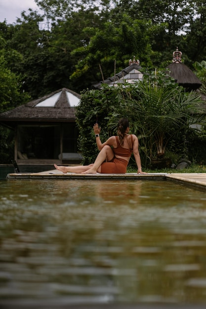 Young Woman Practicing Yoga by the Pool in Bali, Indonesia – Free Stock Photo for Download