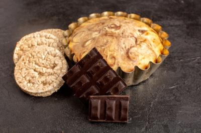 Sweet Round Cake with Choco Bars and Bread Crisps on Grey Background – Free Download