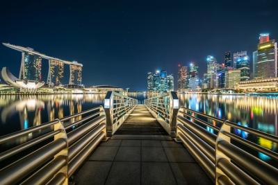 Illuminated City Night View with Long Bridge – Free to Download