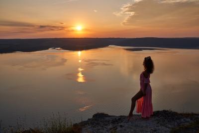 Girl in Light Dress Against a Sunset by the Lake – Free Download, Free Stock Photo