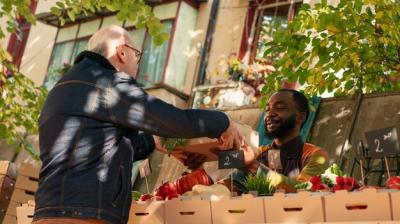 Young Male Farmer Selling Organic Garden Produce at Local Food Market – Free Download