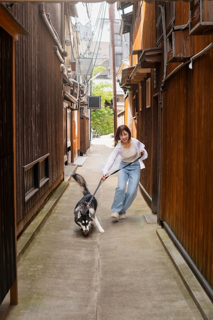 Full Shot of an Asian Woman with a Cute Dog – Free Stock Photo, Download for Free