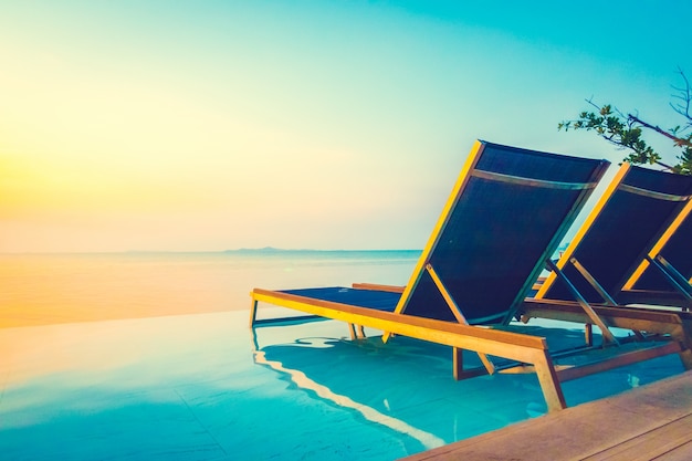 Blue Tropical Hotel Chair and Umbrella – Download Free Stock Photo