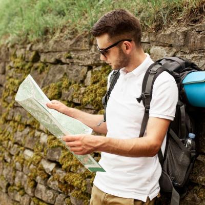 Traveler Reading Map – Download Free Stock Photo