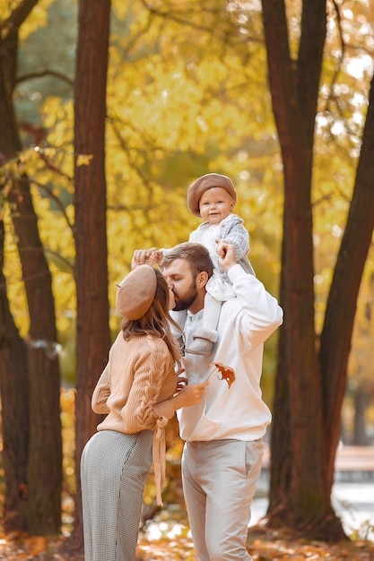 Family Enjoying Time with Their Little Daughter in an Autumn Park – Free Download