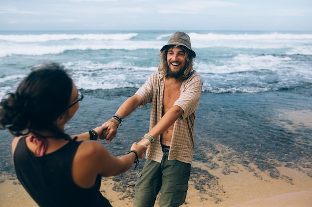 Cheerful Couple Playing on the Beach – Free Stock Photo for Download