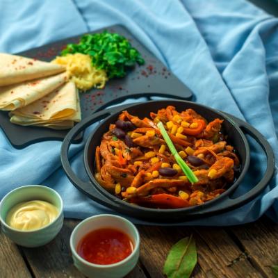 Chicken Fajitas in a Pan with Beans, Pita, and Sauces – Free Download