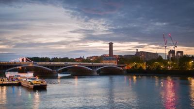 Evening Cityscape of London with Thames River and Train on Bridge – Free Download