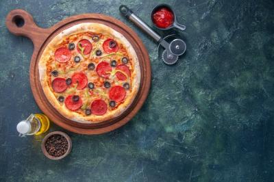 Homemade Pizza with Tomatoes and Oil on Wooden Board – Free Download