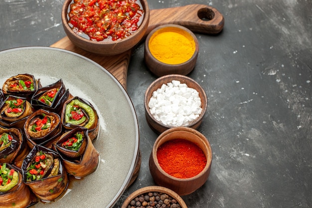 Stuffed Aubergine Rolls on Serving Board with Spices – Free Download