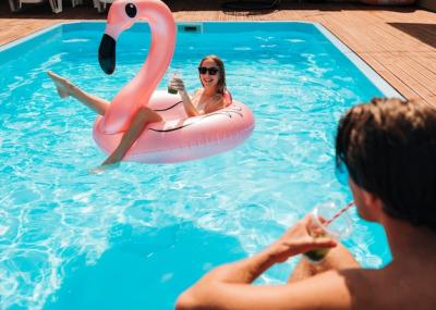 Couple Gazing at Each Other in a Pool – Free Download