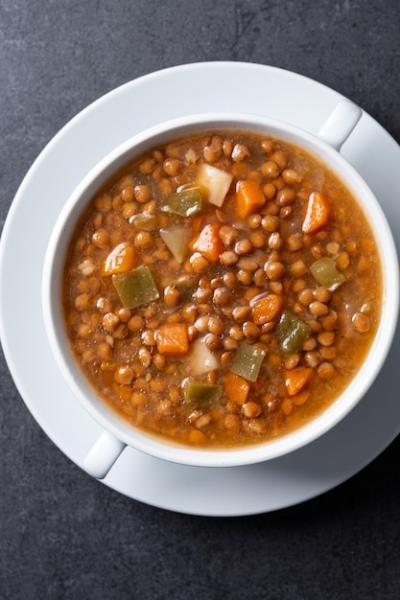 Lentil Soup with Vegetables in Bowl on Black Background – Free Download