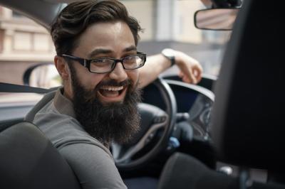 Happy Charismatic Man Driving a Car – Free Download