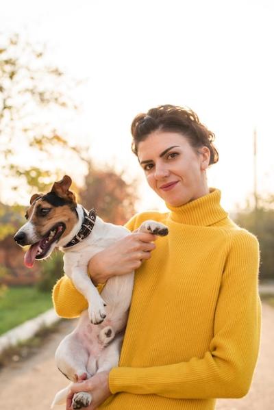 Woman Holding Dog – Free Stock Photo for Download