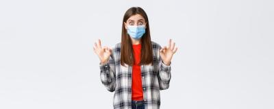 Excited Young Woman in Medical Mask Showing Okay Sign – Free Stock Photo Download