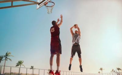 Dynamic Basketball Player Captured at Sunset – Free Download