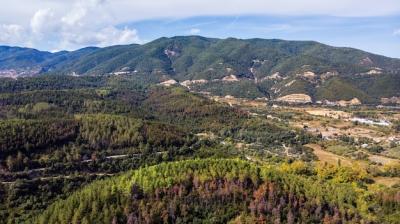 Stunning Drone Panorama of Greece with Lush Green Hills and Valley Buildings – Free Download