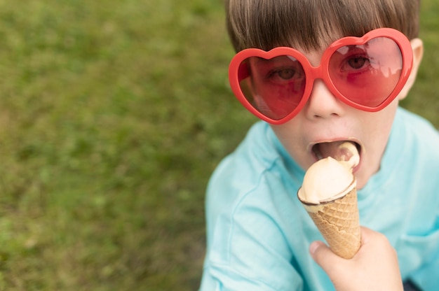 Boy Enjoying Ice Cream with Sunglasses – Free Download