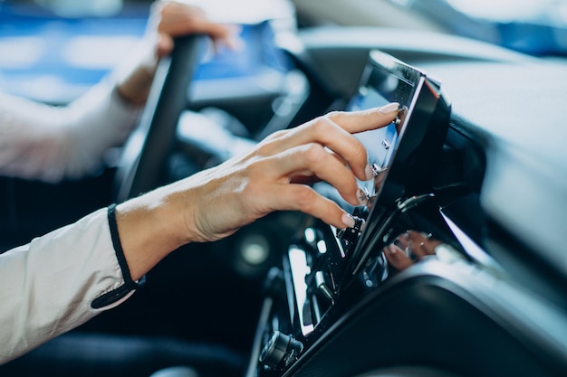 Woman Interacting with Screen Inside Car – Free Download