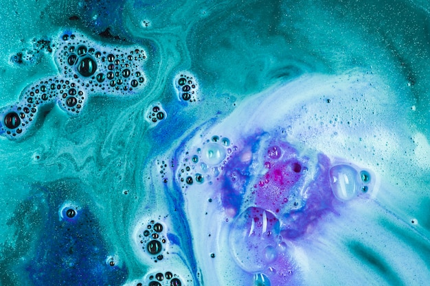 Green Water with Purple Bath Bomb – Free Stock Photo for Download