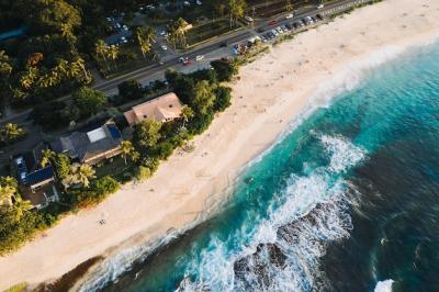 Aerial Shot of Houses and Roads Near the Sandy Beach – Free Download