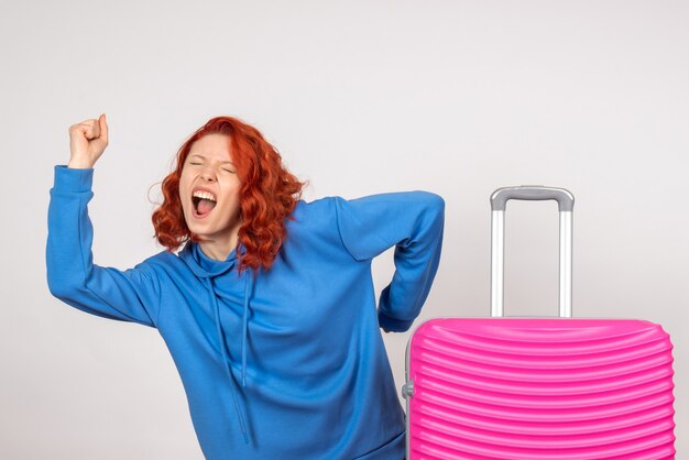 Young Female Tourist with Pink Bag Against White Wall – Free Download