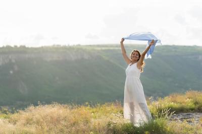 Woman Posing Outdoors with Scarf in the Wind – Free Download