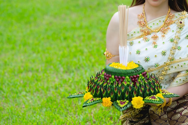 Thai Woman in Traditional Dress Holding Kratong at Loy Krathong Festival – Free Download