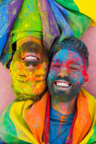 Joyful Gay Couple in Love Covered in Paint – Free Stock Photo for Download