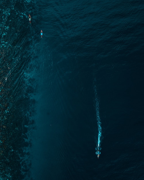 Vertical Aerial Shot of Boats on the Ocean – Free Download