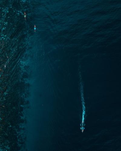 Vertical Aerial Shot of Boats on the Ocean – Free Download